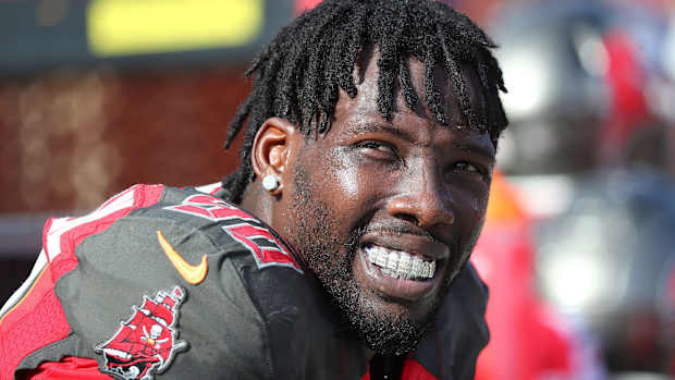 Dec 29, 2019; Tampa, Florida, USA; Tampa Bay Buccaneers linebacker Jason Pierre-Paul (90) looks on with his mouth grill against the Atlanta Falcons during the first half at Raymond James Stadium.
